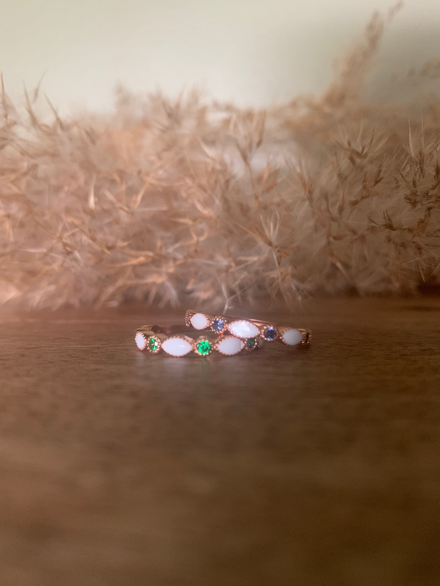 Left: Rose Gold Finish & Emerald Right: Rose Gold & Sapphire